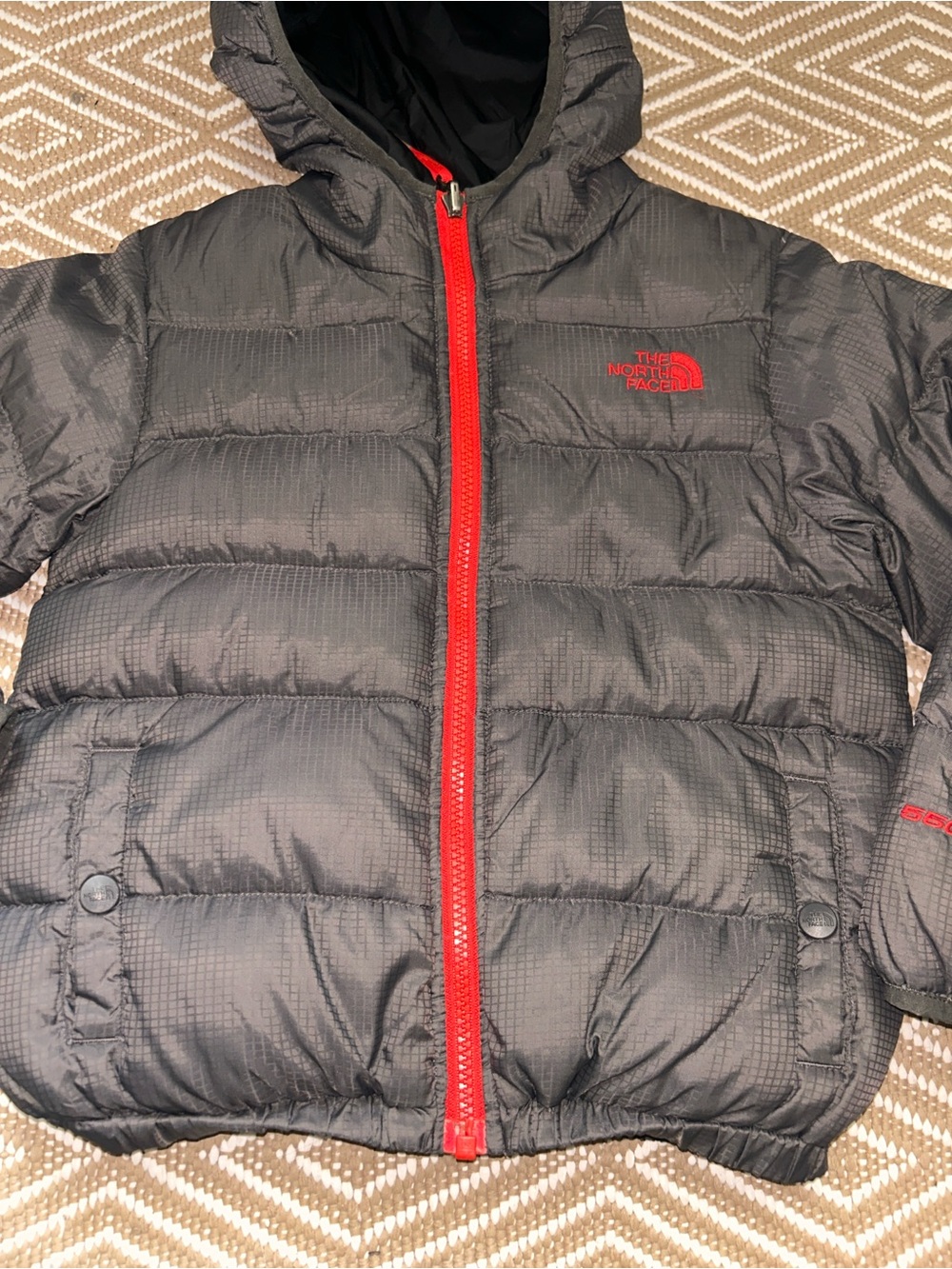 The North Face Kids Black Puffer Jacket with Red Zipper